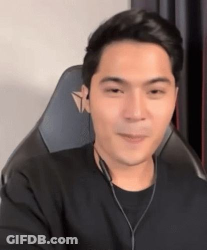 Man In Gaming Chair With Headphones And Black Shirt GIF
