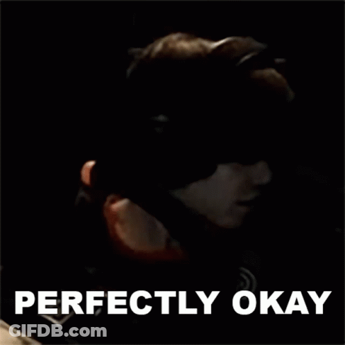 Man In Gas Mask Holding Gun With Perfectly Okay Above GIF