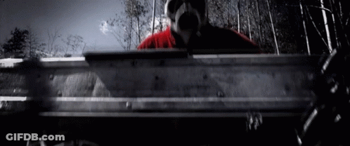 Man In Gas Mask Holding Metal GIF