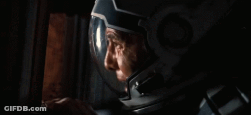 Man In Gas Mask In Dark Room GIF