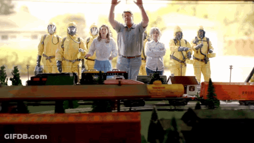 Man In Gas Mask In Front Of Reefer Train GIF