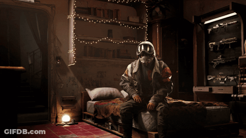 Man In Gas Mask Sitting On Bed GIF