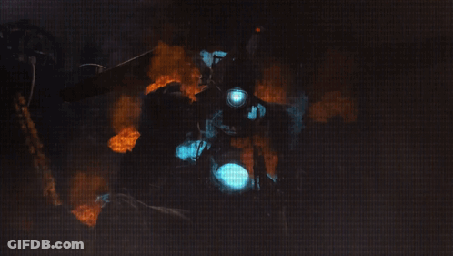 Man In Gas Mask Surrounded By Fire And Smoke GIF