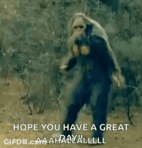 Man In Gas Mask Walking In Woods With Sword GIF