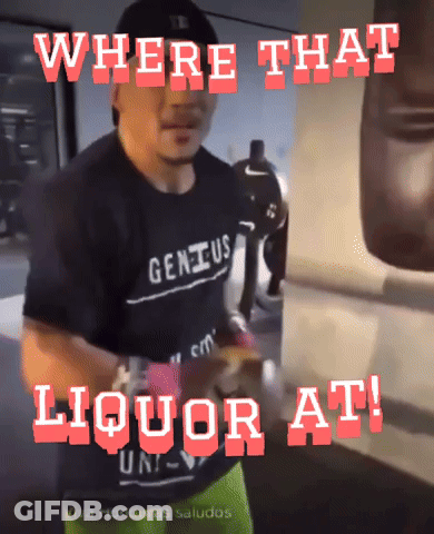 Man In Genius Shirt In Front Of Punching Bag GIF