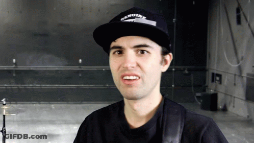 Man In Genuine Hat Looks At Camera GIF