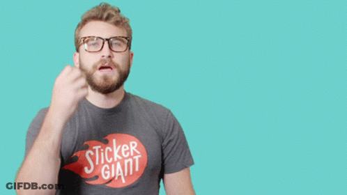 Man In Giant Sticker T-Shirt Holding Fist Up GIF