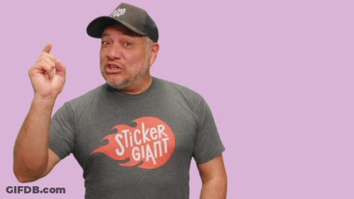 Man In Giant Sticker T-Shirt Pointing GIF