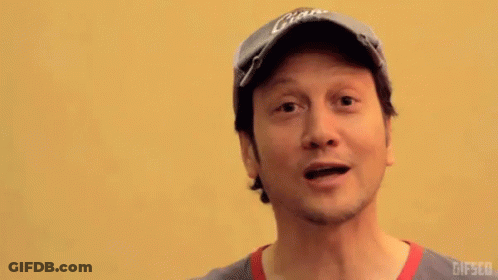 Man In Giants Hat Points At Camera GIF