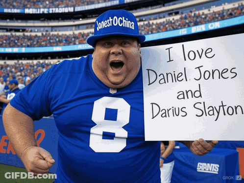 Man In Giants Jersey Holding Sign I Love Daniel Jones And Darius Slayton GIF