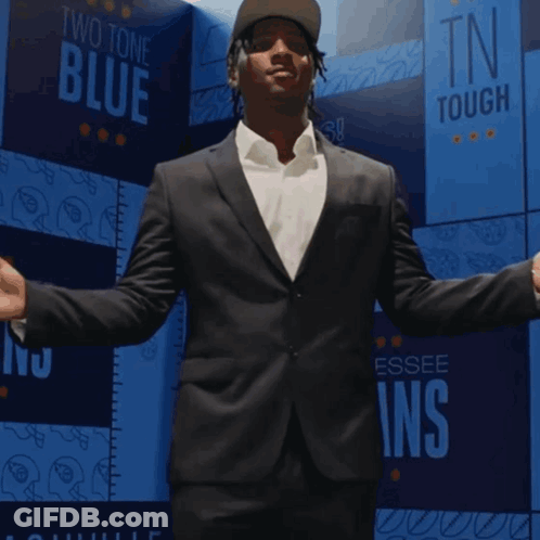 Man In Giants Jersey In Front Of City GIF