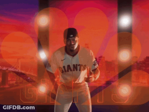 Man In Giants Jersey In Front Of City GIF