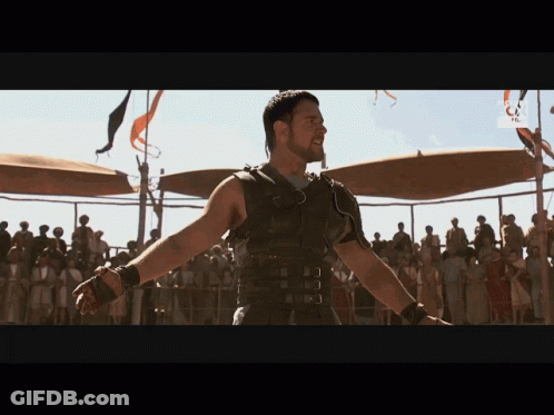 Man In Gladiator Costume Before Crowd With RTL GIF