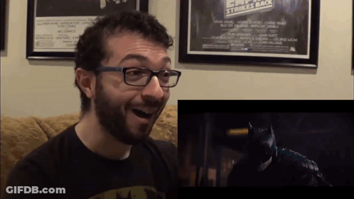 Man In Glasses And Batman Shirt Reacts To Batman Movie GIF