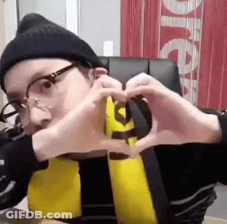 Man In Glasses And Beanie Making Heart GIF