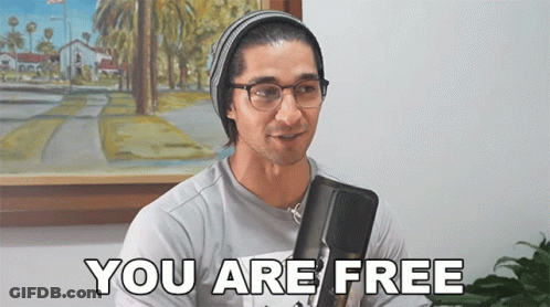 Man In Glasses And Beanie Saying You Are Free GIF