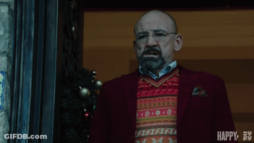 Man In Glasses And Beard With Christmas Sweater And Red Suit GIF