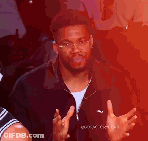Man In Glasses And Black Jacket Making Funny Face GIF