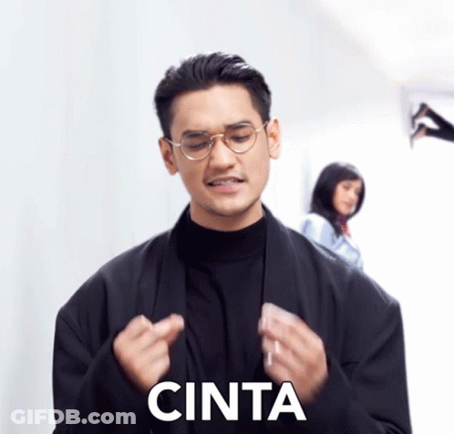 Man In Glasses And Black Jacket Saying Cinta GIF