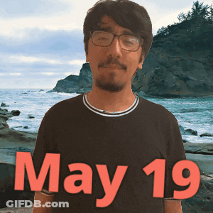 Man In Glasses And Black Shirt At Beach GIF