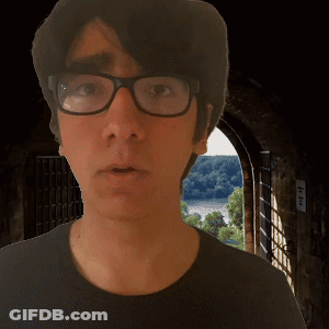 Man In Glasses And Black Shirt At Doorway GIF