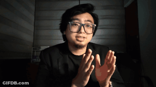 Man In Glasses And Black Shirt Giving Applause GIF