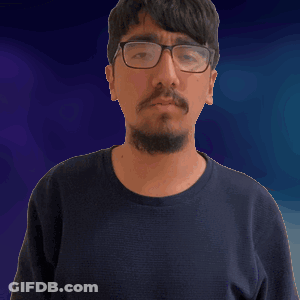 Man In Glasses And Black Shirt Holding Fist Up GIF