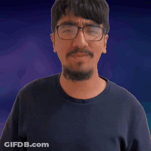 Man In Glasses And Black Shirt Making Fist GIF