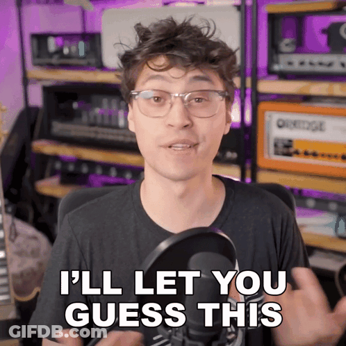 Man In Glasses And Black Shirt Says I'll Let You Guess This GIF