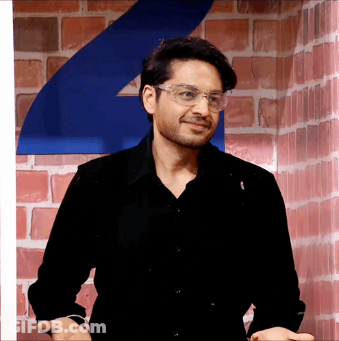 Man In Glasses And Black Shirt Smiling GIF