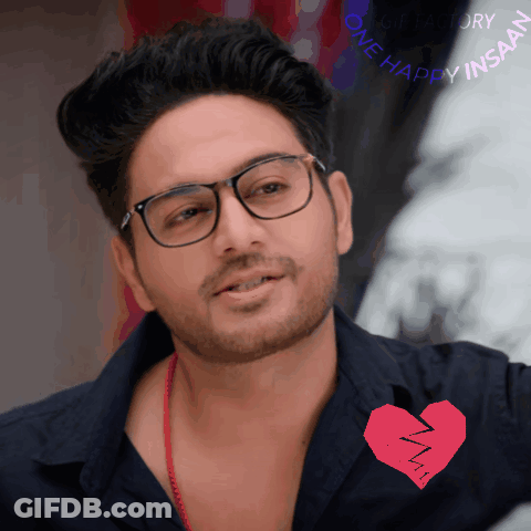 Man In Glasses And Black Shirt With Broken Heart Saying One Happy Insan GIF