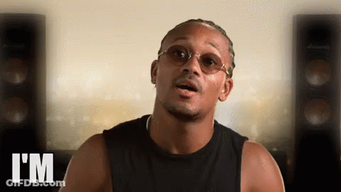 Man In Glasses And Black Tank Top Says I'm In Front Of Speakers GIF