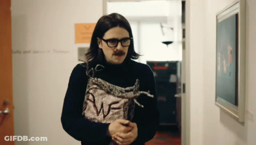 Man In Glasses And Black Turtleneck Holding Paper Saying Awf GIF