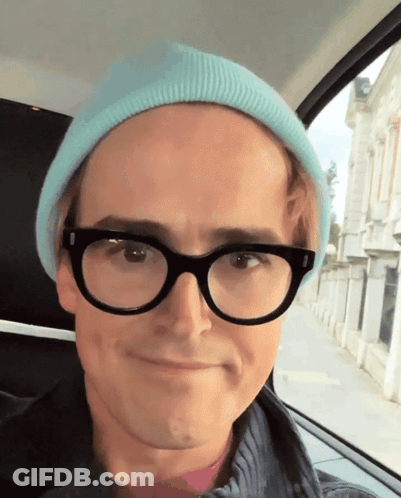 Man In Glasses And Blue Beanie Smiling GIF
