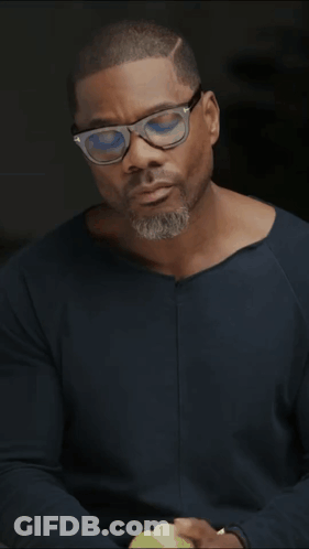 Man In Glasses And Blue Shirt Holding Green Apple GIF