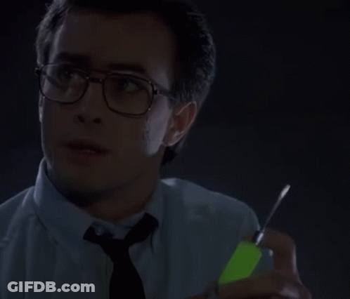 Man In Glasses And Blue Shirt Looking At Watch GIF