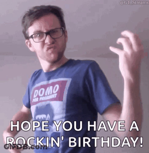 Man In Glasses And Blue Shirt Saying Hope You Have A Rockin Birthday GIF