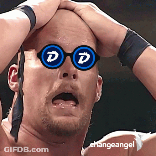 Man In Glasses And Blue Shirt Sitting In Crowd GIF