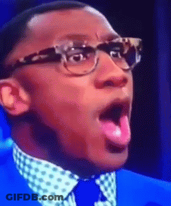 Man In Glasses And Blue Suit Sticking Tongue Out GIF
