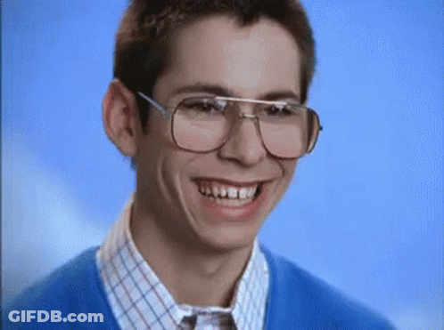 Man In Glasses And Blue Sweater Making Funny Face GIF