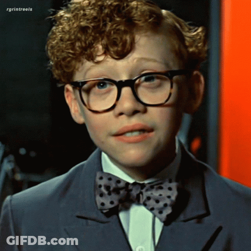 Man In Glasses And Blue Sweater Making Funny Face GIF