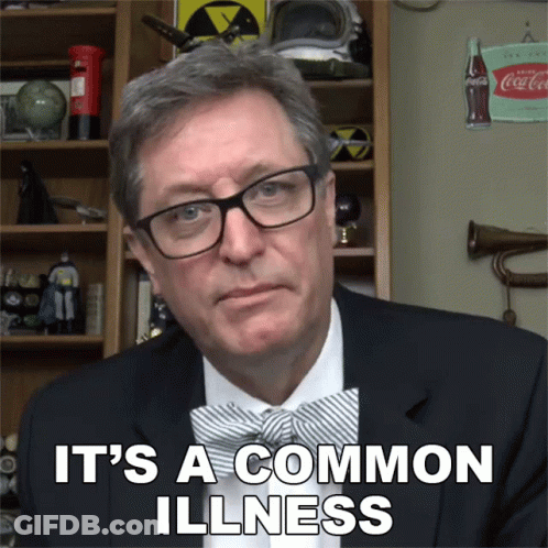 Man In Glasses And Bow Tie Says It's A Common Illness GIF