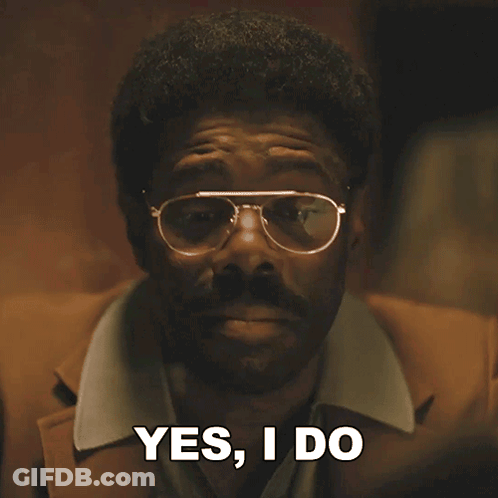 Man In Glasses And Brown Jacket Says Yes I Do GIF