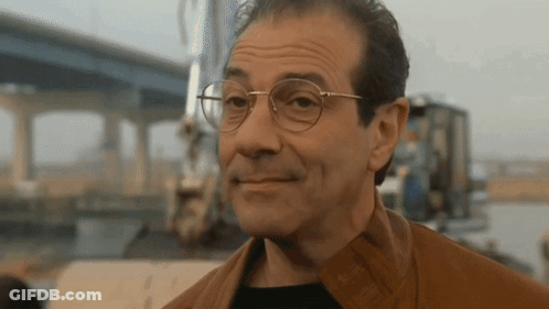 Man In Glasses And Brown Jacket Smiling GIF