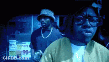 Man In Glasses And Bucket Hat At 99 Cents Sign GIF