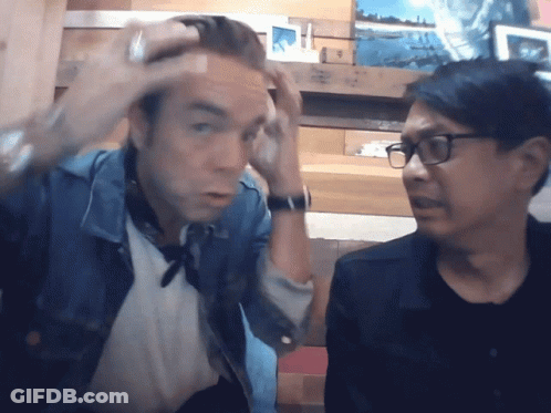 Man In Glasses And Denim Jacket Hand To Forehead GIF