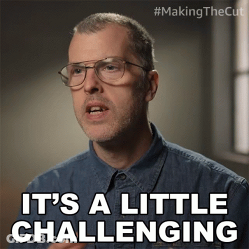 Man In Glasses And Denim Shirt Says It's A Little Challenging GIF
