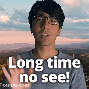 Man In Glasses And Gray Shirt Says Long Time No See GIF