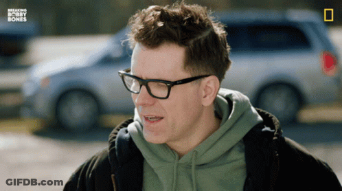 Man In Glasses And Green Hoodie With Breaking Bobby Bones GIF