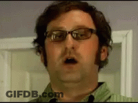 Man In Glasses And Green Shirt Open Mouth GIF